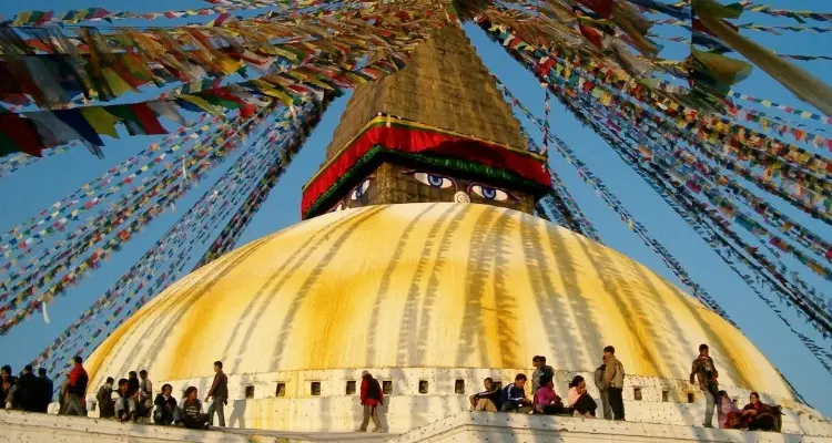 people walking around the white pagoda