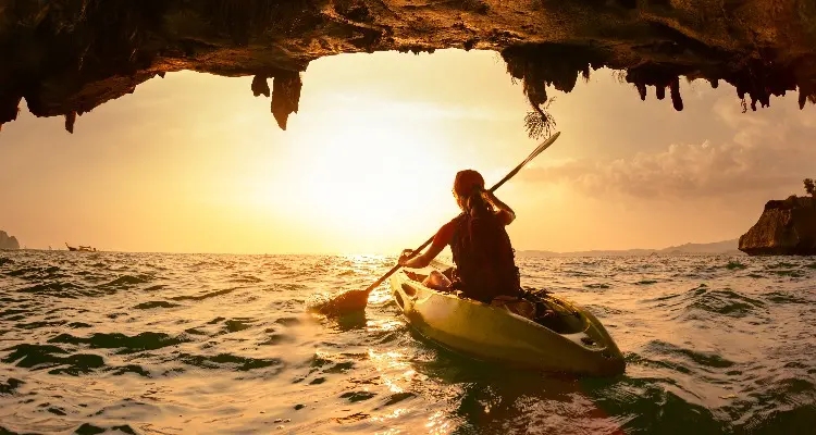 kayaking to a cave