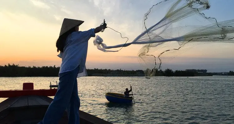 casting traditional Vietnamese fishing netshave close encounter with elephant in the jungle