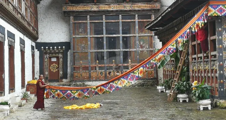a monk collecting the flag