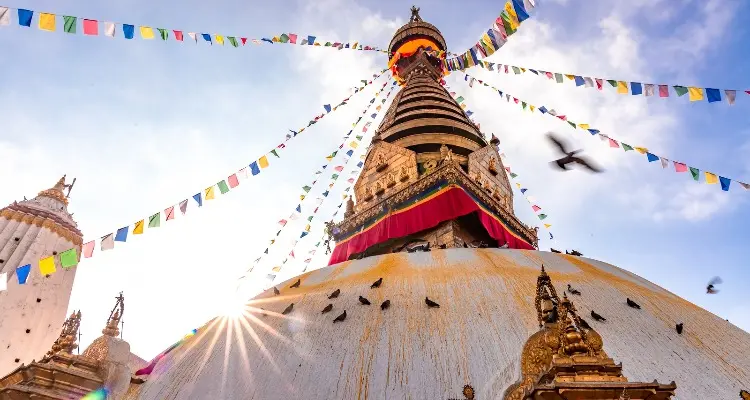 the white pagoda and the colorful flags